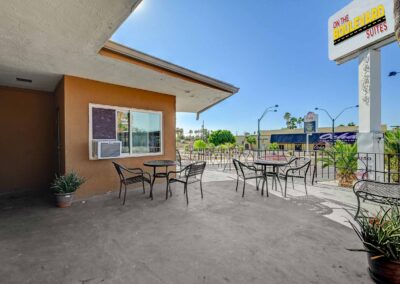 On the Boulevard | Extended-Stay, Hotel-Style Living Spaces | Sitting Area with Monument Sign